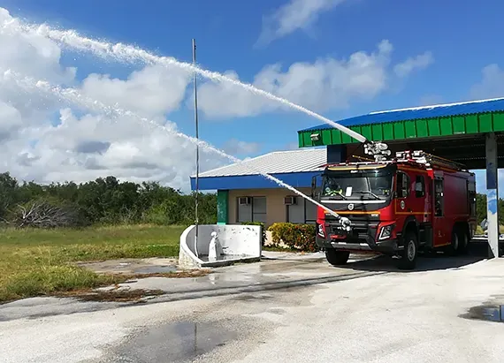 Fire monitors mounted as front and roof-mounted units on a tanker fire engine