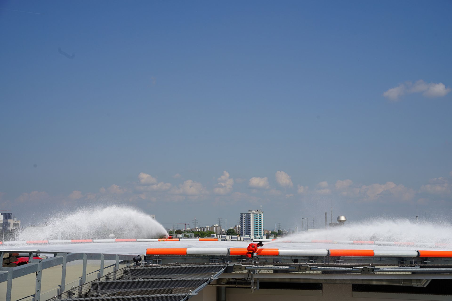 Two FireDos extinguishing monitors on a helipad