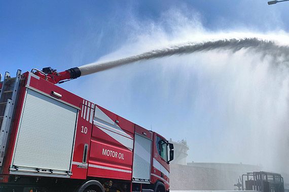 Fire monitor M5 mounted on a tank fire truck operating in full jet mode.