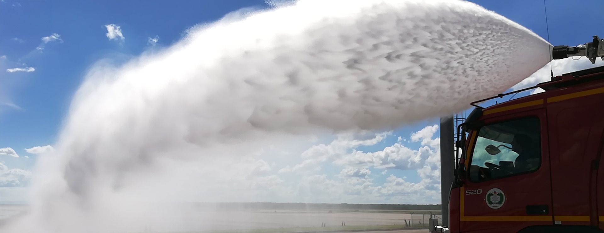 FireDos fire monitor on fire vehicle in action with spray jet